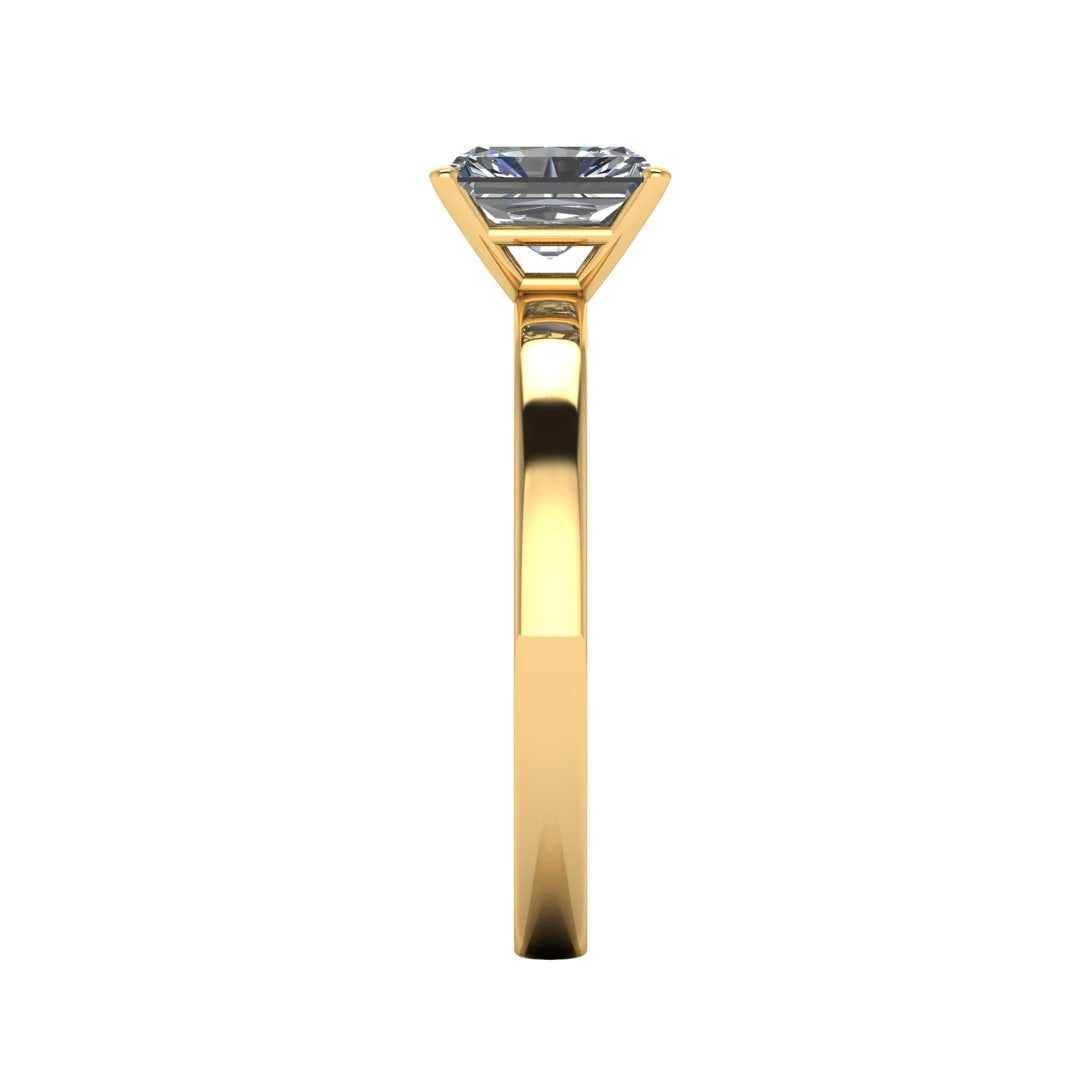 side view of yellow gold engagement ring with an emerald cut lab grown diamond as the centre stone in a floating setting