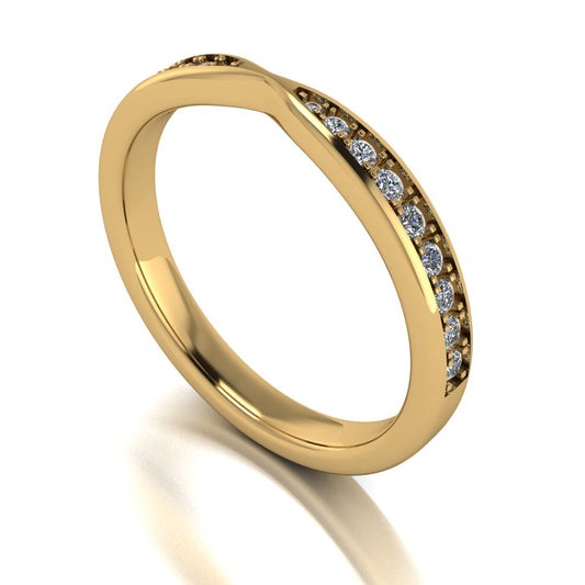 angled view of yellow gold tapered wedding band. Round lab-grown diamonds appear in a graduated setting starting from the middle and gradually increasing in size towards the edges