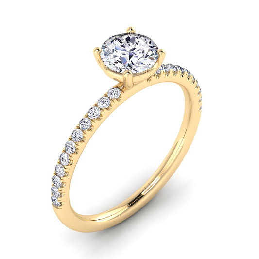Angled view of Isabella engagement in yellow gold with a round brilliant diamond in a floating setting with pavé-set