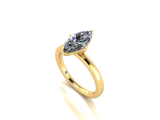 angled view of a yellow gold lab grown marquise diamond engagement ring. It is a single solitaire ring with a floating setting