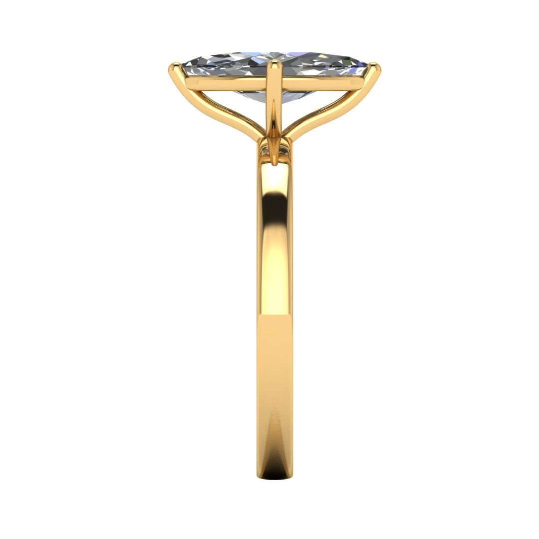 side view of a yellow gold lab grown marquise diamond engagement ring. It is a single solitaire ring with a floating setting