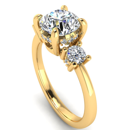 Angled view of yellow gold trilogy engagement ring with three round brilliant lab grown diamond