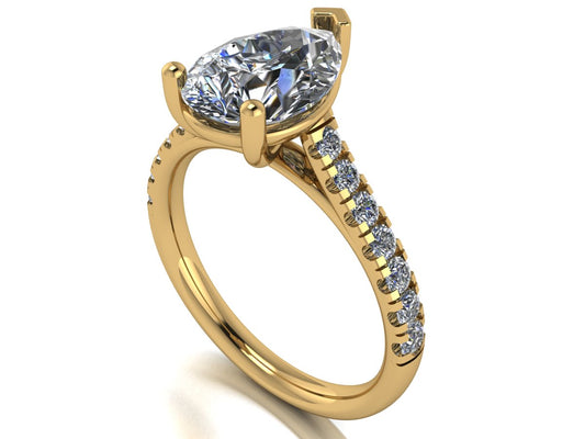 angled view of yellow gold pavé engagement ring with a pear shaped centre lab grown diamond and microset diamond shoulder