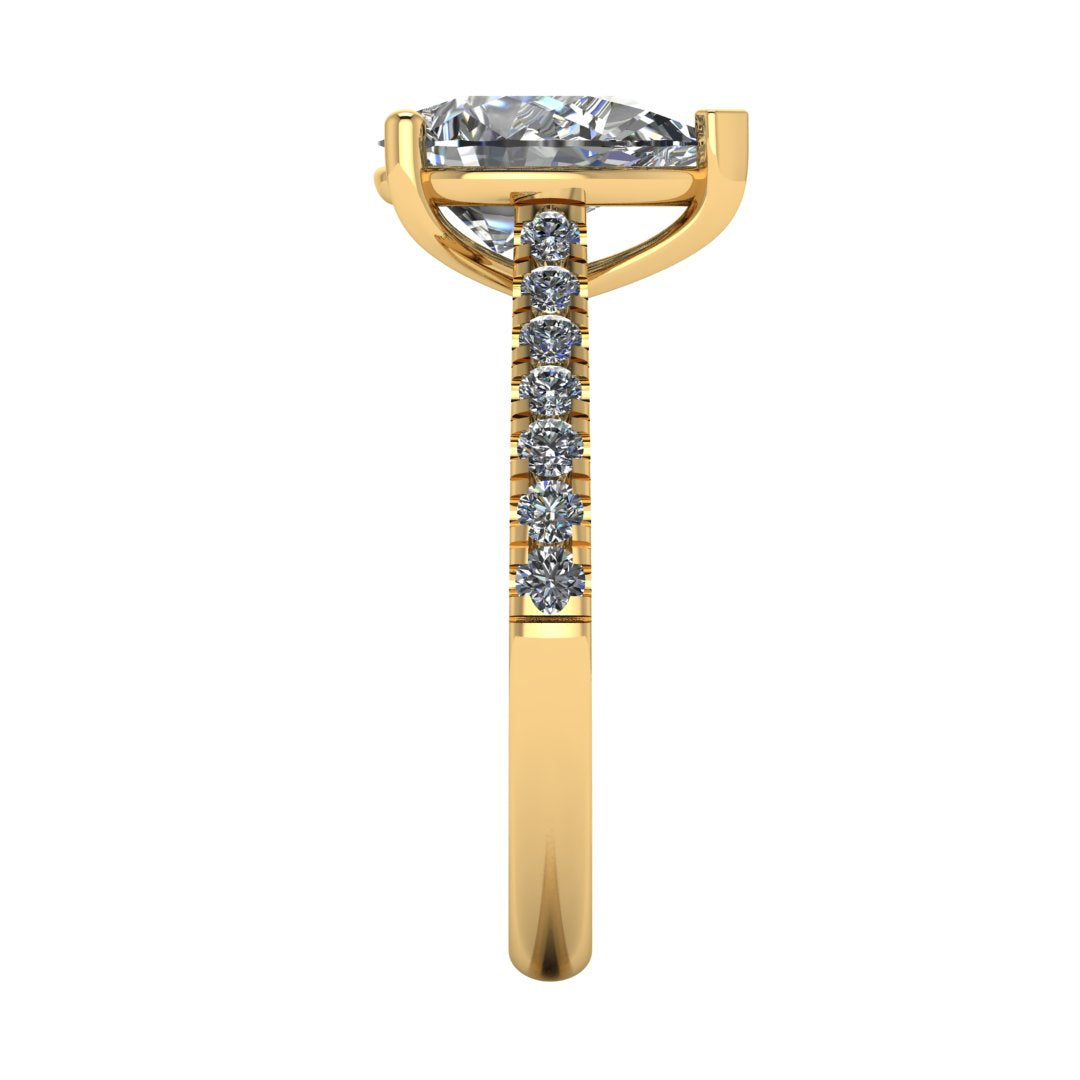 side view of yellow gold pavé engagement ring with a pear shaped centre lab grown diamond and microset diamond shoulder