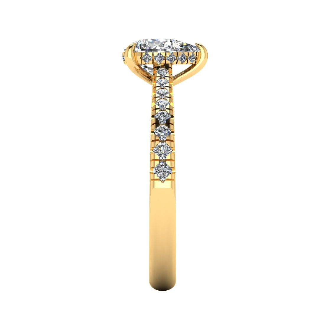 side view of a yellow gold engagement ring, there is a pear cut centre lab grown diamond which has a hidden under halo and pavé-set diamond shoulders