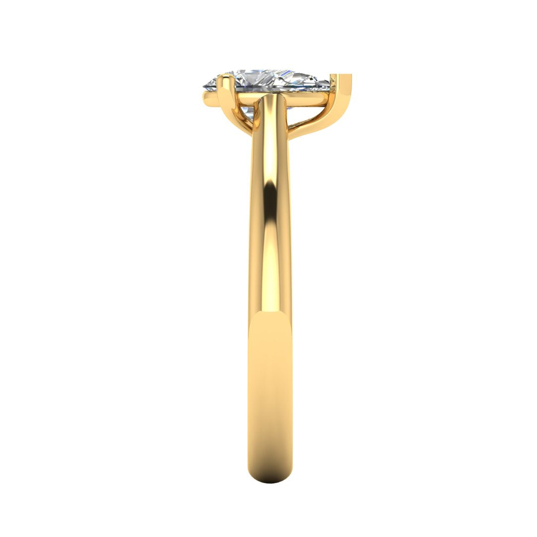 side view of yellow gold engagement ring with a pear cut lab grown diamond which is ethical and sustainable