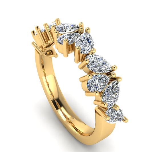 angled view off a glamourous intricate yellow gold eternity ring which can also be worn as a wedding band featuring pear cut lab-grown diamonds arranged in a pattern