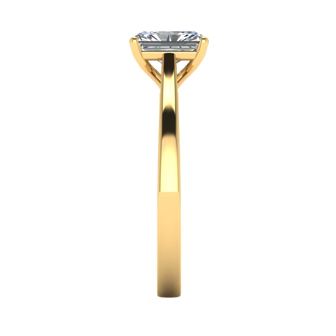 side view of a yellow gold engagement ring set with a radiant cut lab grown diamond with 4 claws