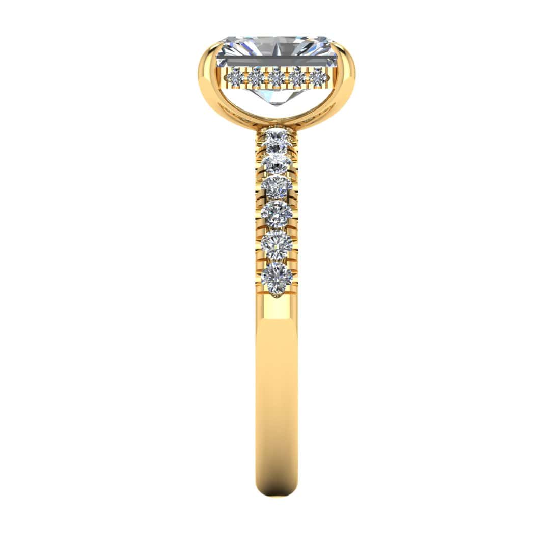 side view of yellow gold engagement ring featuring a radiant cut lab-grown diamond with pavé-set shoulders and a hidden halo