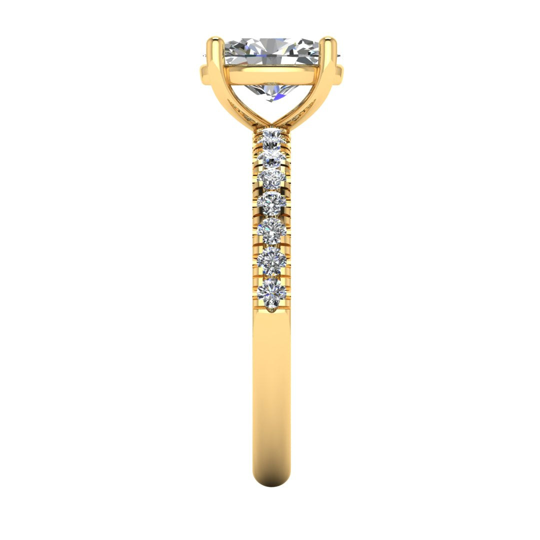 Side view of yellow gold engagement ring with oval cut lab grown diamond set on a pave band with side shoulder stones
