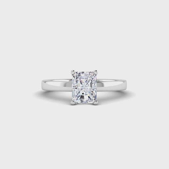 front view of platinum or white gold engagement ring with an emerald cut lab grown diamond as the centre stone in a floating setting