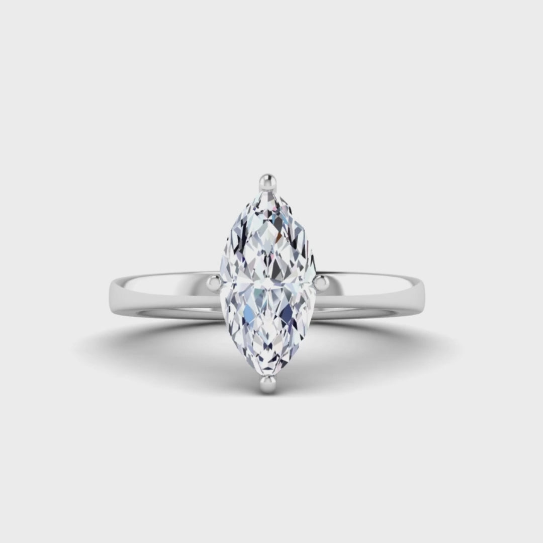 360 video of a platinum or white gold lab grown marquise diamond engagement ring. It is a single solitaire ring with a floating setting