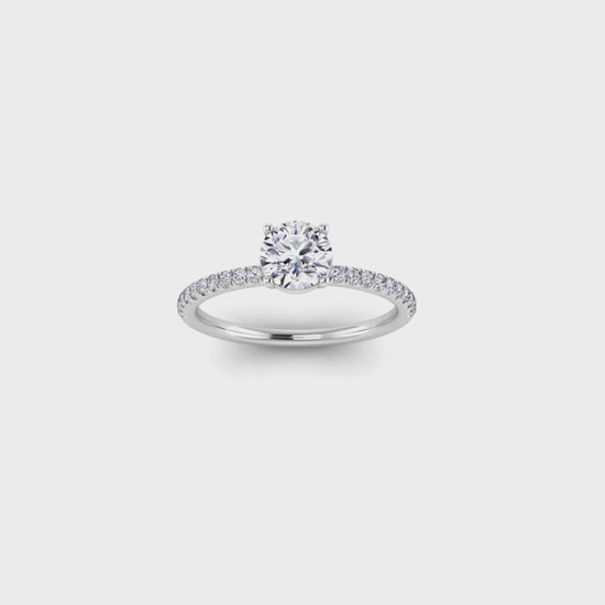 video showing a 360 view in white gold and platinum Isabella engagement ring with a round brilliant lab grown diamond in a floating setting with pave set shoulders with smaller diamonds