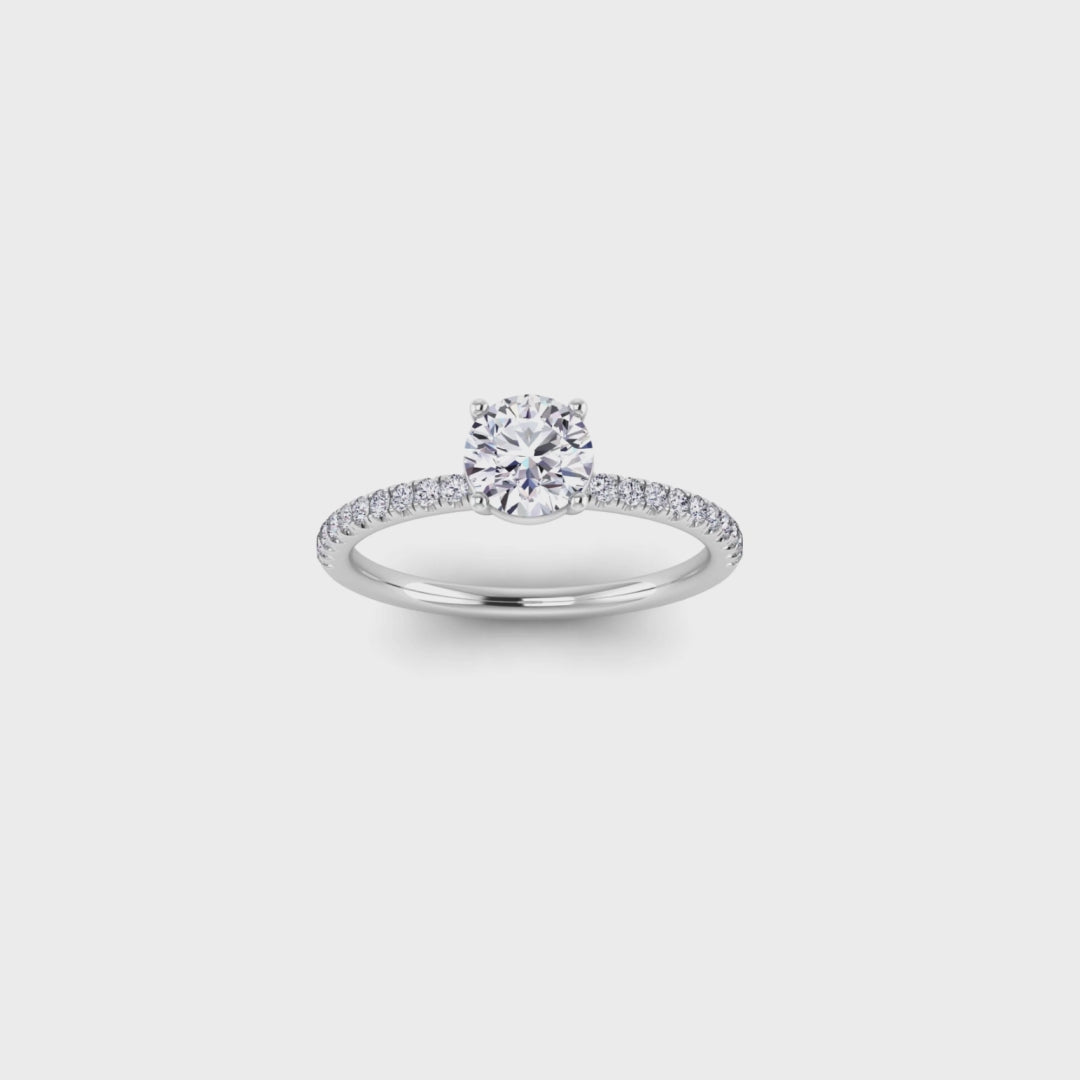 video showing a 360 view in white gold and platinum Isabella engagement ring with a round brilliant lab grown diamond in a floating setting with pave set shoulders with smaller diamonds