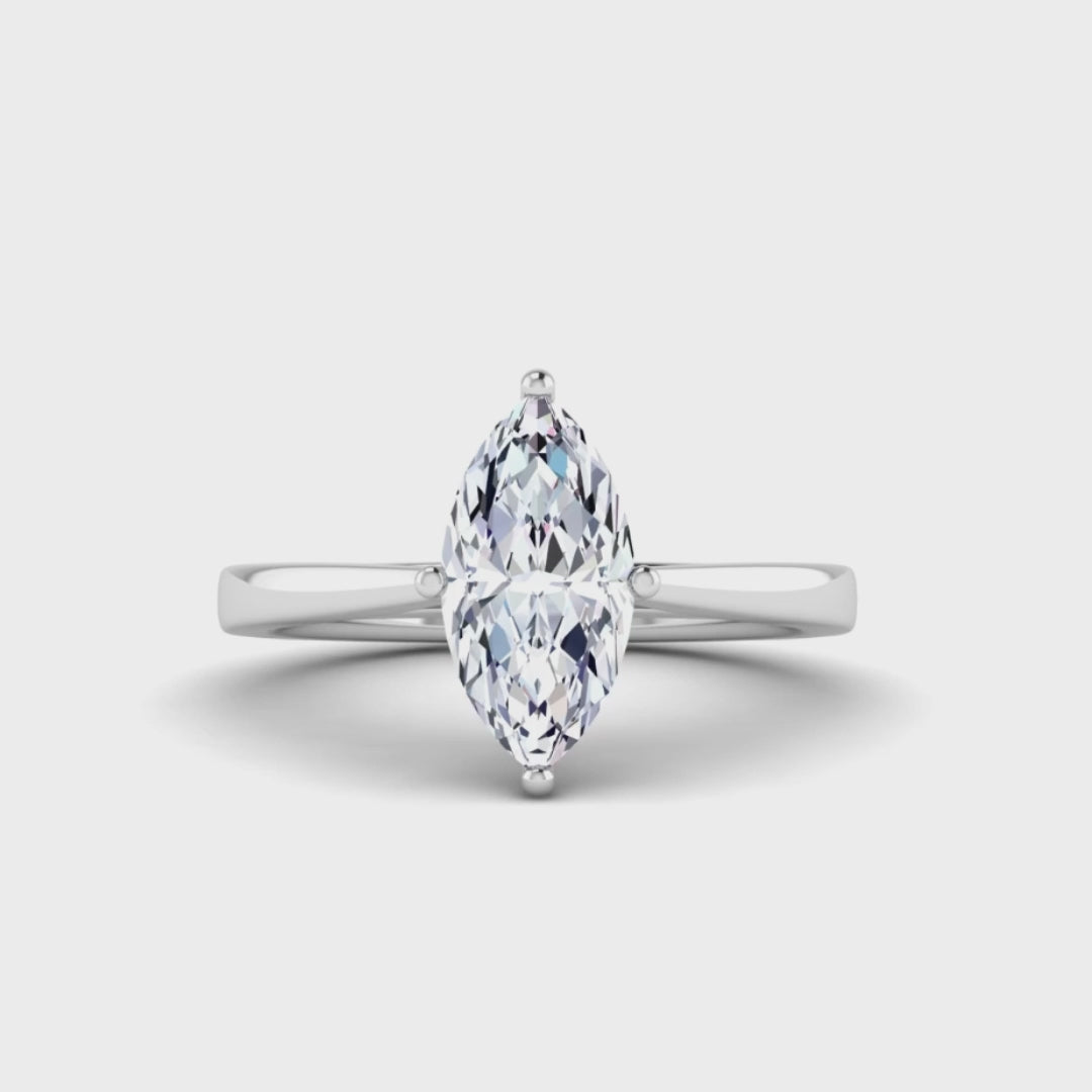 video of platinum or white gold single solitaire engagement ring with a marquise cut lab grown ethical and sustainable diamond in a cathedral setting