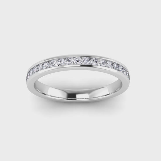 video view of a platinum or white gold eternity ring or wedding band with round brilliant lab grown diamonds in a channel setting