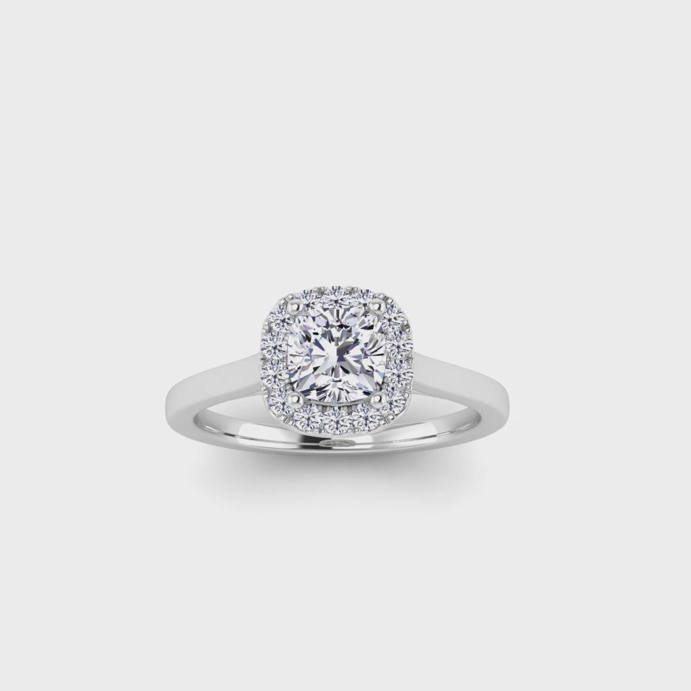 360 video view of a platinum, white gold and yellow gold cushion cut lab grown diamond engagement ring framed by a sparkling halo