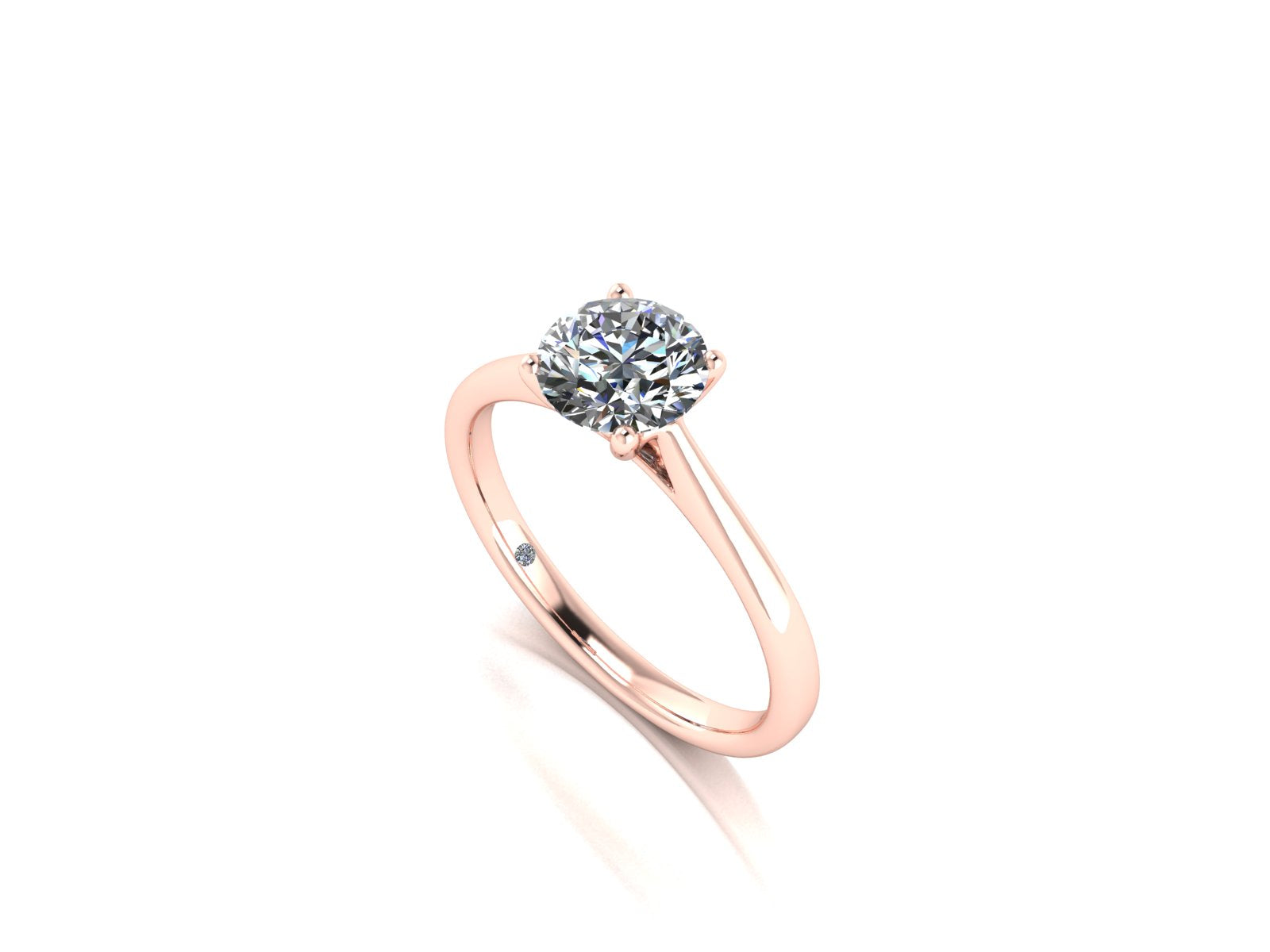 Angled view of the Arya Engagement ring in rose gold. A traditional single solitaire round brilliant lab grown diamond in a cathedral setting