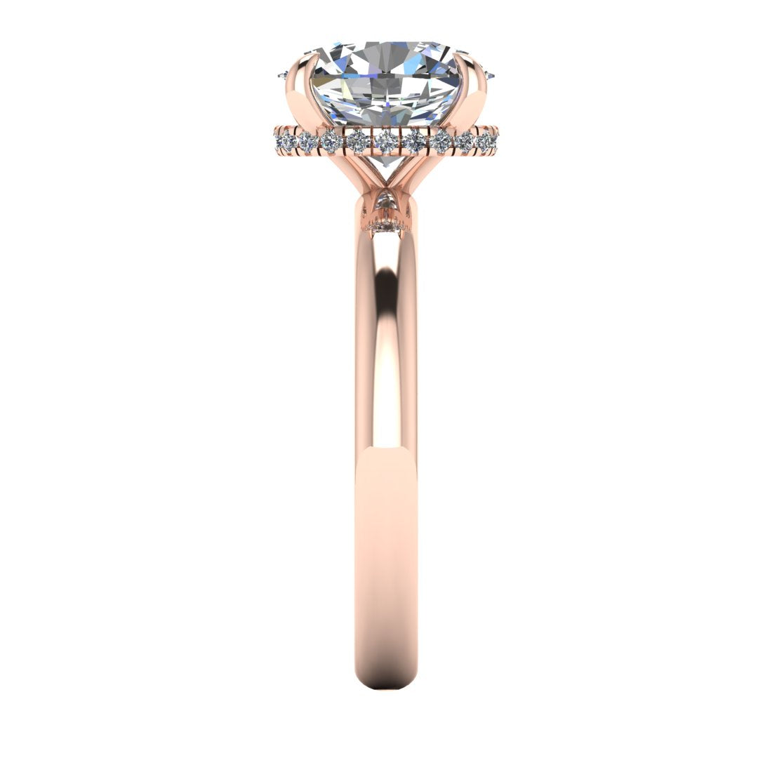 side view of a rose gold engagement ring with a oval cut lab grown diamond with a secret hidden halo