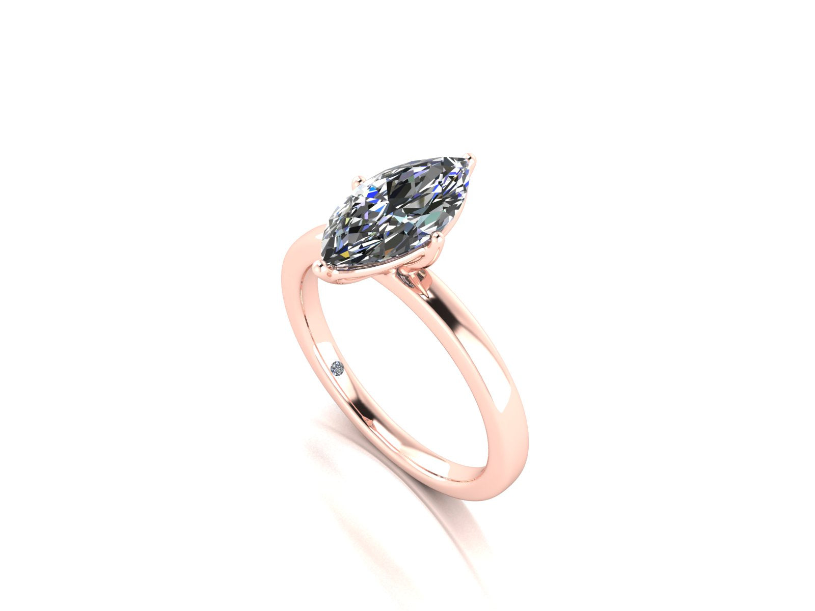 angled view of a rose gold lab grown marquise diamond engagement ring. It is a single solitaire ring with a floating setting