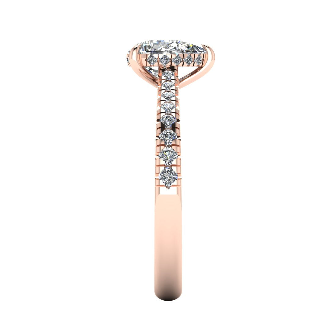 side view of a rose gold engagement ring, there is a pear cut centre lab grown diamond which has a hidden under halo and pavé-set diamond shoulders