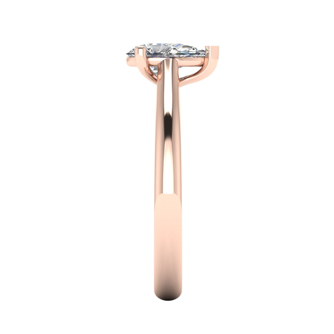 side view of rose gold engagement ring with a pear cut lab grown diamond which is ethical and sustainable