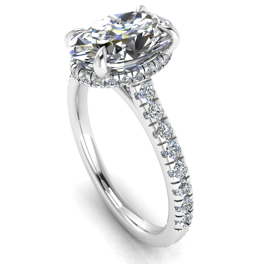 side view of platinum and white gold oval cut lab grown diamond engagement ring with secret hidden halo and diamond band