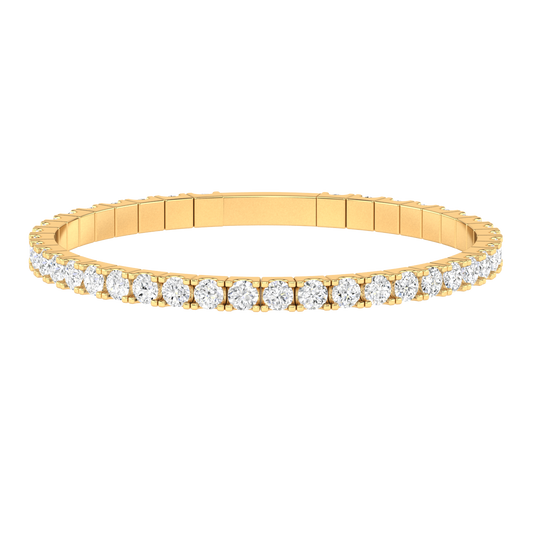 Front view of a yellow gold flexible bangle which stretches over your wrist for easy dressing