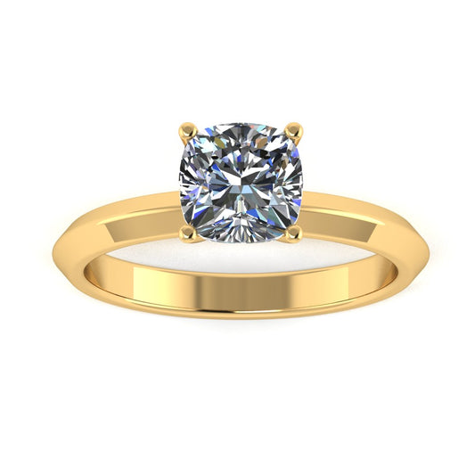 front view of yellow gold engagement ring featuring a cushion cut lab grown diamond in a floating setting with 4 claws