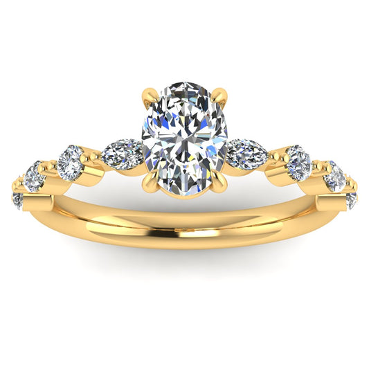 Front view of yellow gold of Lily engagement ring with an oval cut centre stone surrounded by alternating smaller round and marquise stones on the shoulder