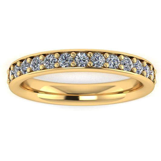 front view of a yellow gold eternity ring or wedding band with round brilliant lab-grown diamonds set in a fine grain setting