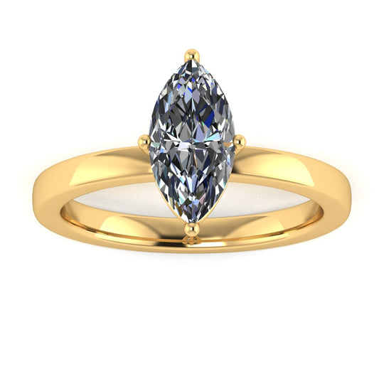 front view of a yellow gold lab grown marquise diamond engagement ring. It is a single solitaire ring with a floating setting