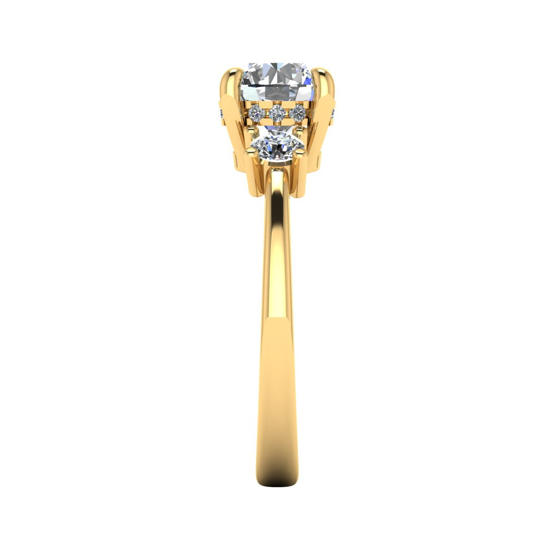 Side profile of yellow gold trilogy engagement ring with three round brilliant lab grown diamond