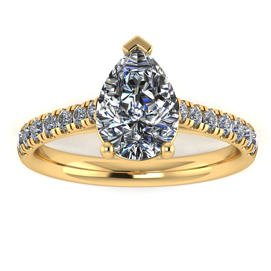 front view of yellow gold pavé engagement ring with a pear shaped centre lab grown diamond and microset diamond shoulder