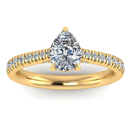 front view of a yellow gold engagement ring, there is a pear cut centre lab grown diamond which has a hidden under halo and pavé-set diamond shoulders