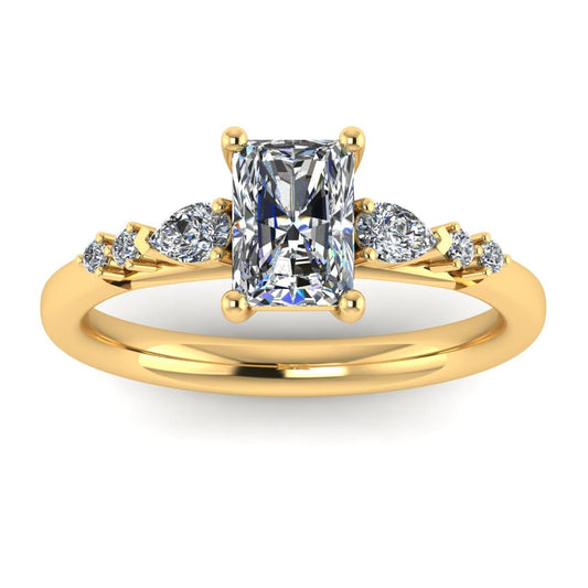 front view of a yellow gold multi-stone lab grown diamond engagement ring. It features a radiant cut lab-grown diamond with one pear and two round side diamonds on either side